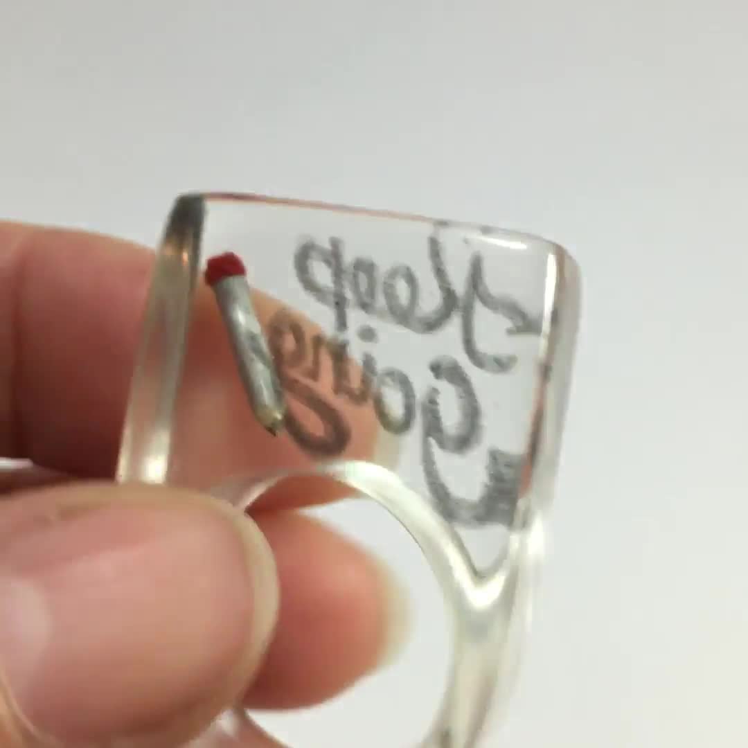 Calligraphic resin ring with handlettering and mini pencil Keep going