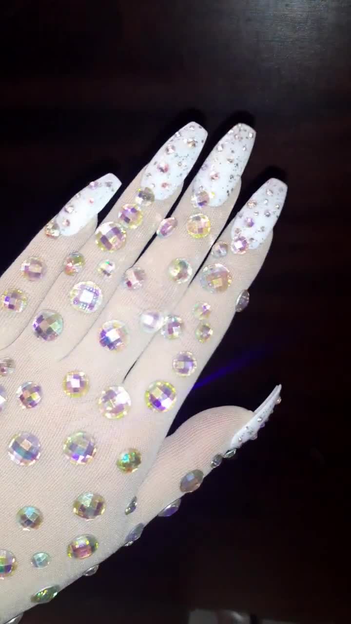 white gloves with nails