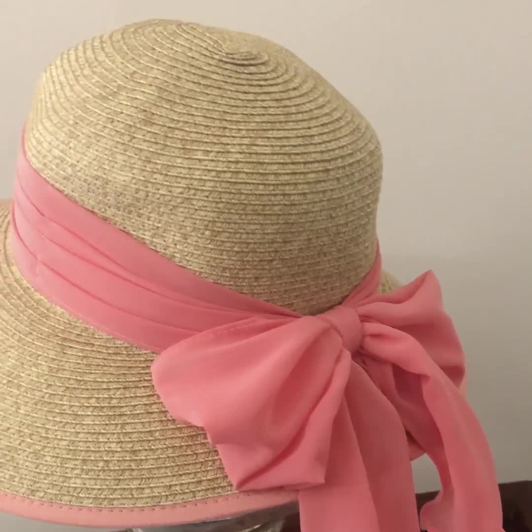 sun hat with pink ribbon