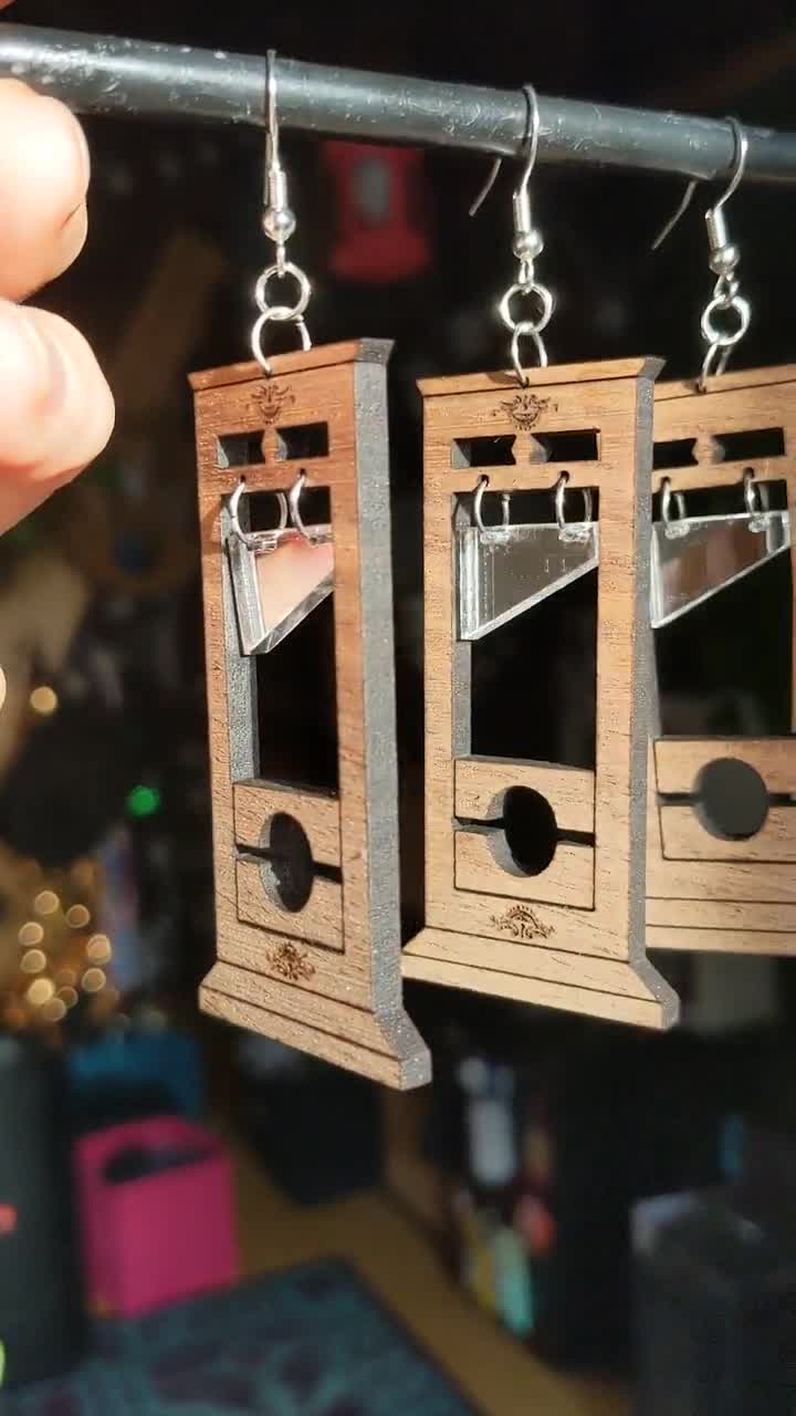 guillotine earrings jeff bezos